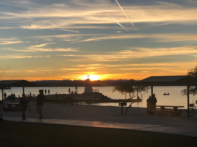 Sun setting behind the lighthouse point