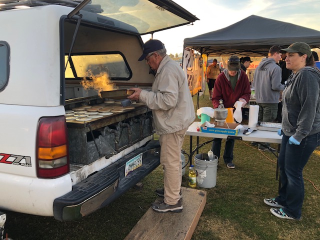 Pancakes cooking in the back of a pickup truck